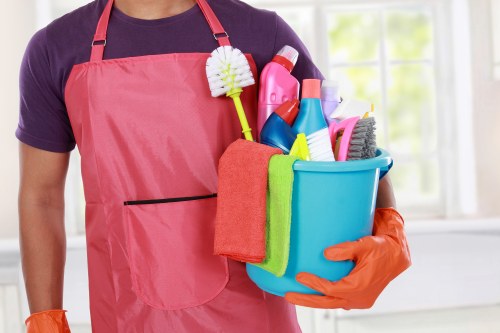 Technician preparing carpet cleaning equipment safely
