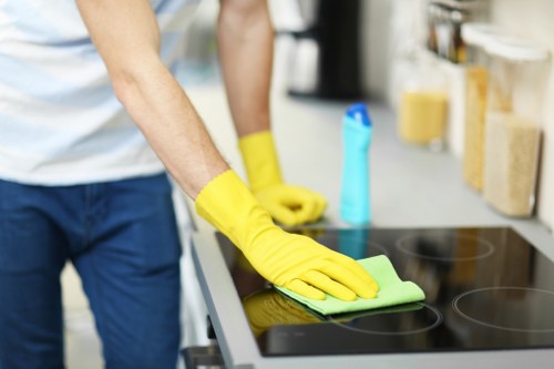 Domestic cleaner tidying a family home in Dulwich